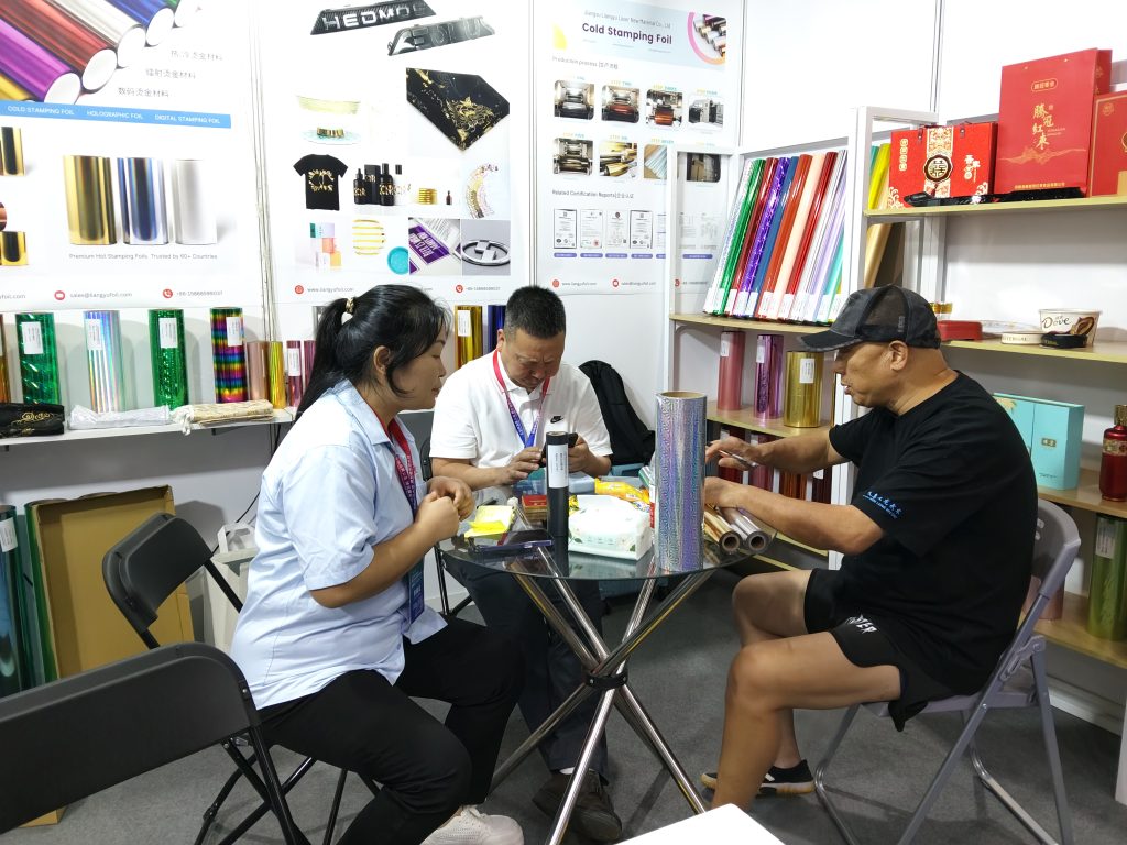 LiangyuFoil technical discussion for packaging foil and label sample testing at Yiwu exhibition